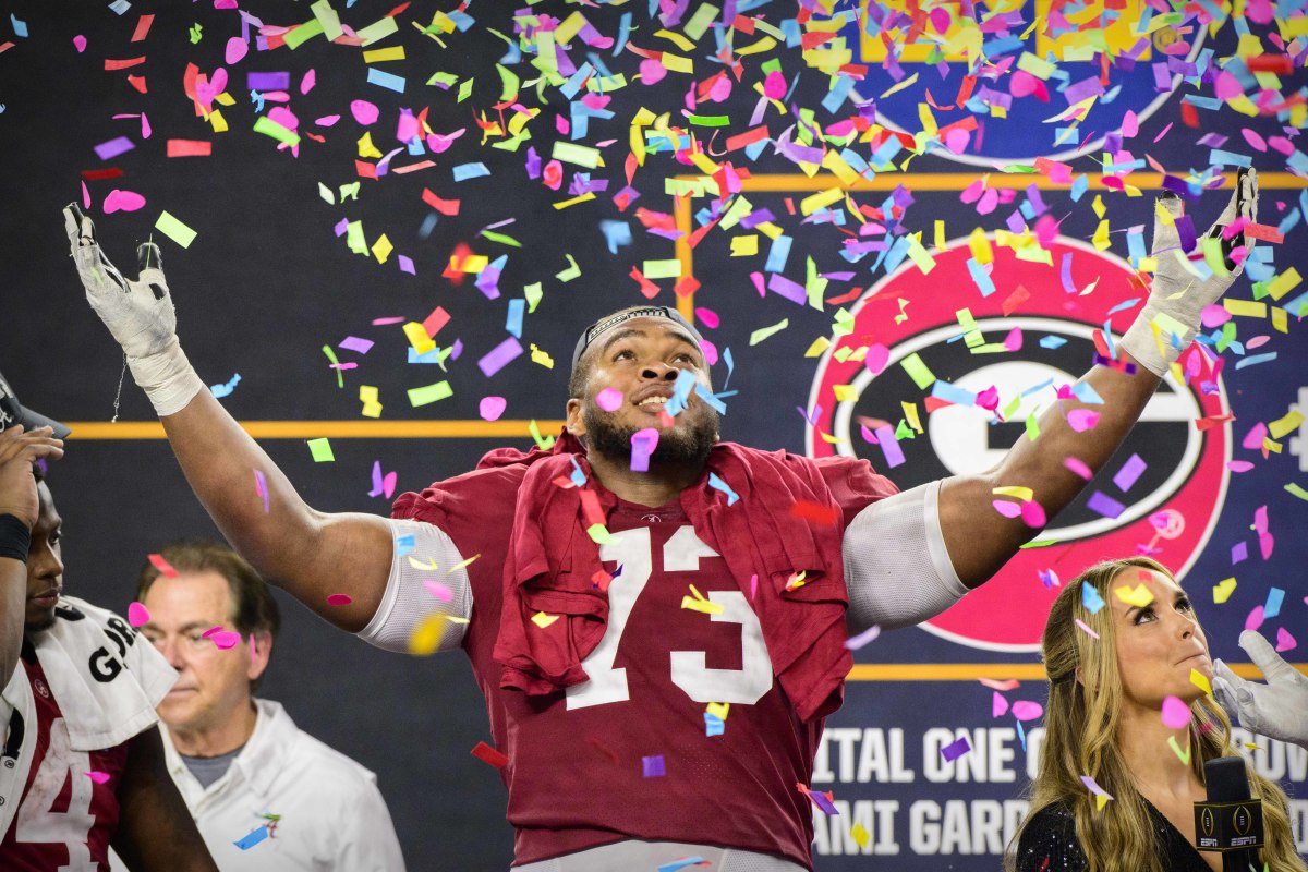 Alabama Crimson Tide offensive lineman Evan Neal (73) celebrates the win over the Cincinnati Bearcats after the 2021 Cotton Bowl college football CFP national semifinal game at AT&T Stadium.